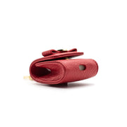 Swatzell + Heilig's AirPod Case in color red, picture showing the hole in the bottom of the item ideal for airpods.