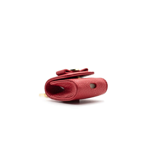 Swatzell + Heilig's AirPod Case in color red, picture showing the hole in the bottom of the item ideal for airpods.